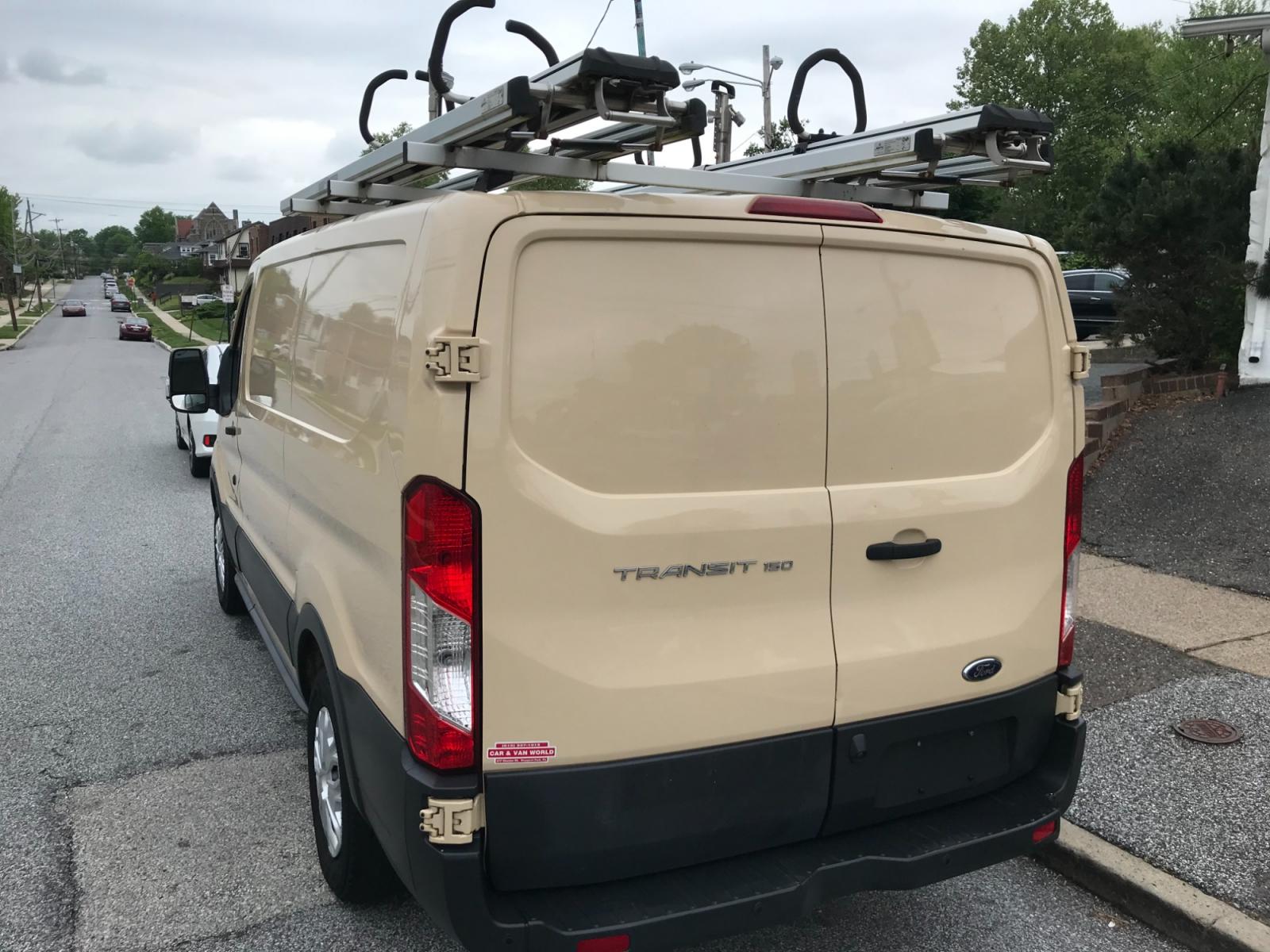 2017 Tan /Gray Ford Transit 150 (1FTYE1YM0HK) with an 3.7 V6 engine, Automatic transmission, located at 577 Chester Pike, Prospect Park, PA, 19076, (610) 237-1015, 39.886154, -75.302338 - 2017 Ford Transit 150: Ladder racks, multiple pieces of shelving, backup camera, partition, power locks and windows, FLEET MAINTAINED, runs LIKE NEW! This vehicle comes inspected and has been given a bumper to bumper safety check. It is very clean, reliable, and well maintained. We offer a unique - Photo #5